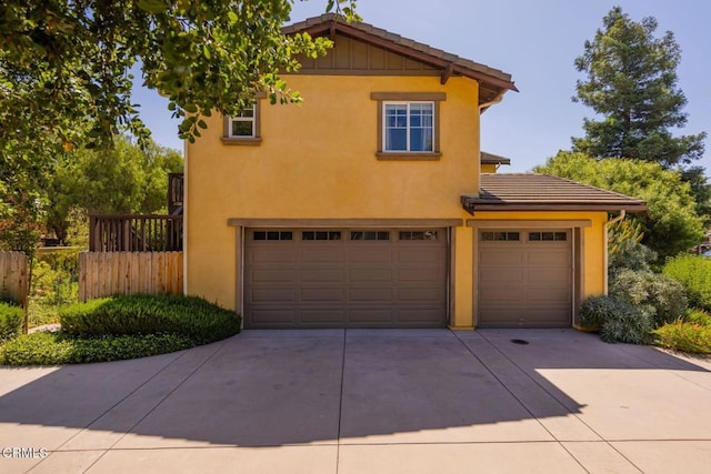 11570 Oakcrest Ave, Ojai, CA 93023 - view of front facade with driveway, an attached garage, stucco siding, and a tile roof