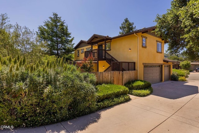 11570 Oakcrest Ave, Ojai, CA 93023 - view of front of property featuring a garage, driveway, stucco siding, and stairs
