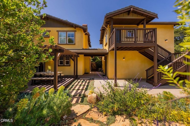 11570 Oakcrest Ave, Ojai, CA 93023 - rear view of property featuring a patio, stucco siding, and stairway