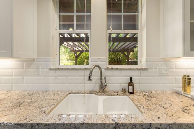 11570 Oakcrest Ave, Ojai, CA 93023 - kitchen featuring white cabinets, light stone countertops, and tasteful backsplash