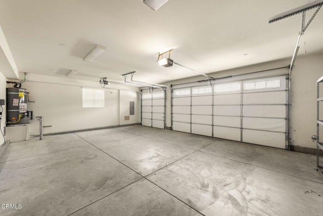 11570 Oakcrest Ave, Ojai, CA 93023 - garage with strapped water heater and a garage door opener