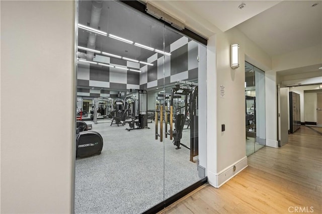 24545 Town Center Dr Unit 5201, Valencia, CA 91355 - gym with wood finished floors