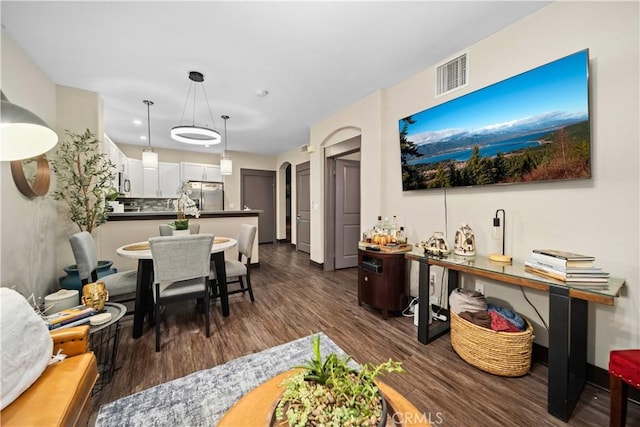 24545 Town Center Dr Unit 5201, Valencia, CA 91355 - living area with dark wood finished floors and arched walkways