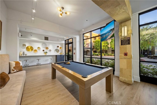 24545 Town Center Dr Unit 5201, Valencia, CA 91355 - recreation room with wood finished floors and billiards table