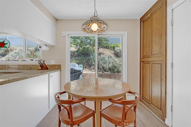 360 Carpio Dr, Diamond Bar, CA 91765 - dining room featuring light wood-style flooring and a textured ceiling