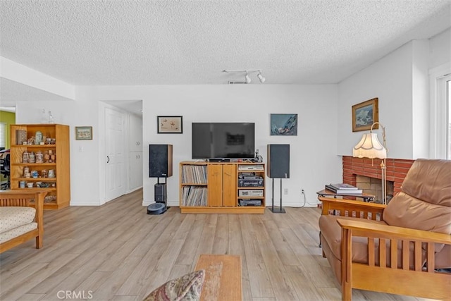 360 Carpio Dr, Diamond Bar, CA 91765 - living room featuring a textured ceiling and light wood-type flooring