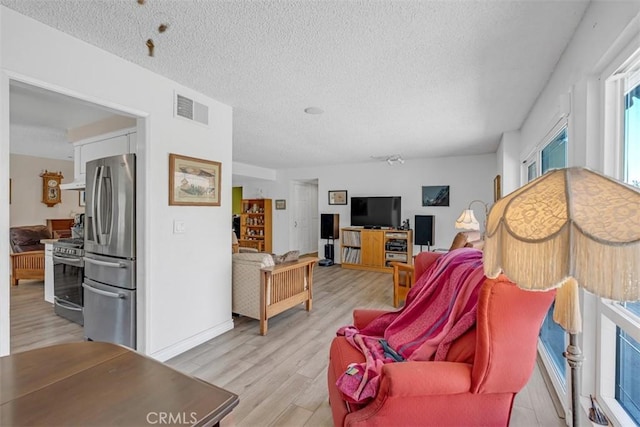 360 Carpio Dr, Diamond Bar, CA 91765 - living area with a textured ceiling and light wood-style floors