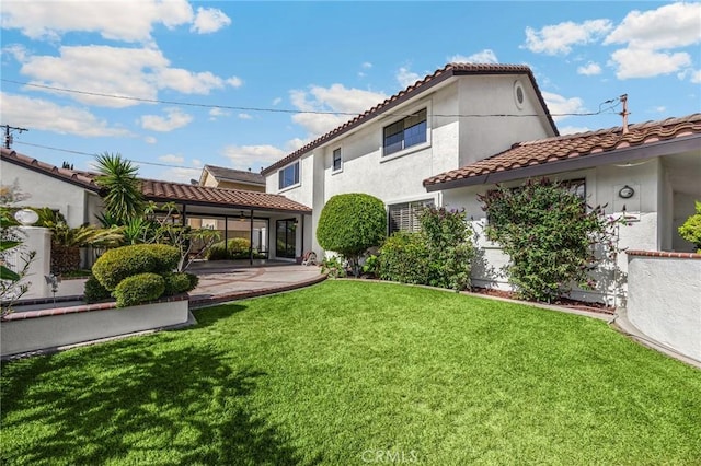 4161 Ricardo Dr, Yorba Linda, CA 92886 - rear view of house featuring a tiled roof, a lawn, stucco siding, and a patio