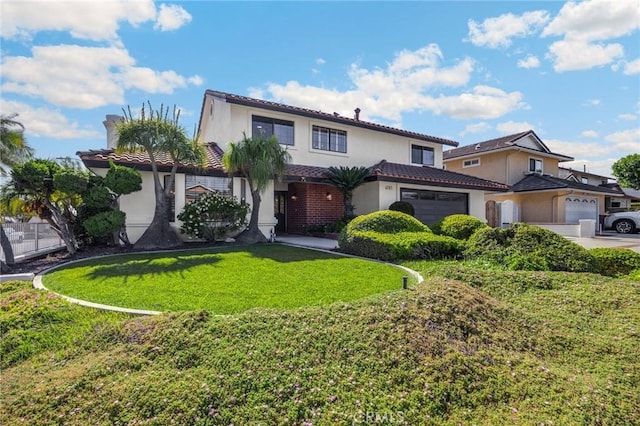 4161 Ricardo Dr, Yorba Linda, CA 92886 - mediterranean / spanish-style home featuring an attached garage, stucco siding, a front lawn, and a tile roof