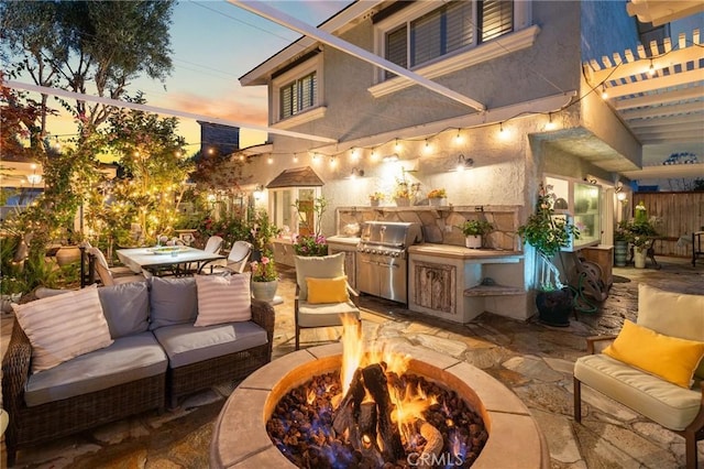 2172 N Pami Cir, Orange, CA 92867 - view of patio featuring an outdoor living space with a fire pit, an outdoor kitchen, and outdoor dining area