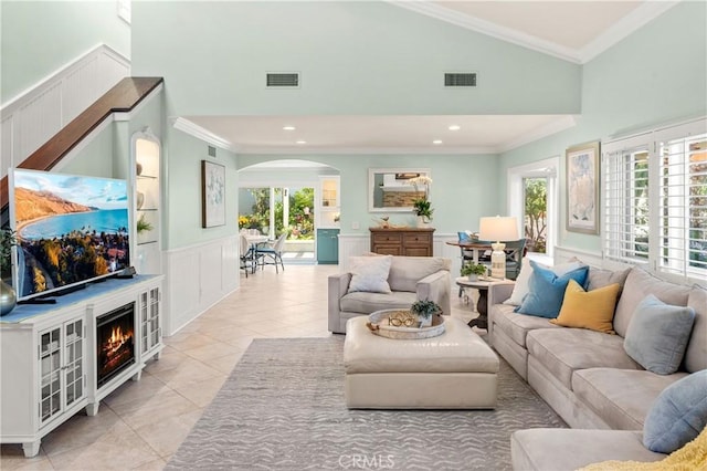 2172 N Pami Cir, Orange, CA 92867 - living area with arched walkways, a decorative wall, healthy amount of natural light, crown molding, and high vaulted ceiling
