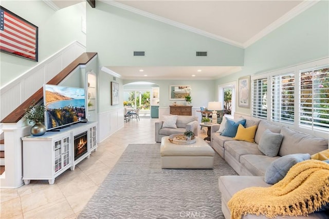 2172 N Pami Cir, Orange, CA 92867 - living room with arched walkways, ornamental molding, a decorative wall, tile patterned flooring, and a wainscoted wall