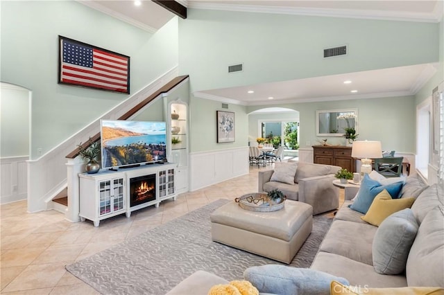 2172 N Pami Cir, Orange, CA 92867 - living area featuring arched walkways, healthy amount of natural light, high vaulted ceiling, tile patterned flooring, and a decorative wall