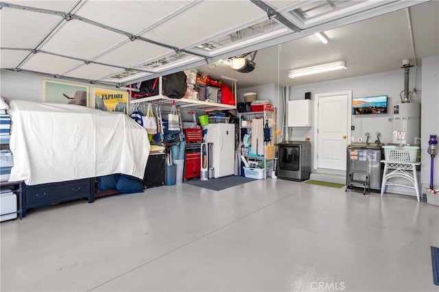 2172 N Pami Cir, Orange, CA 92867 - garage featuring secured water heater, washer / dryer, a garage door opener, and freestanding refrigerator