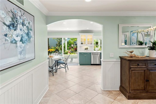 2172 N Pami Cir, Orange, CA 92867 - corridor featuring arched walkways, a wainscoted wall, crown molding, a decorative wall, and light tile patterned floors