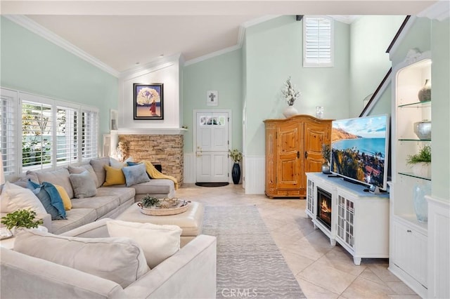 2172 N Pami Cir, Orange, CA 92867 - living area with ornamental molding, lofted ceiling, plenty of natural light, a fireplace, and light tile patterned floors