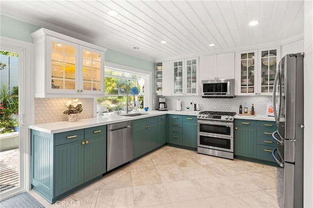 2172 N Pami Cir, Orange, CA 92867 - kitchen featuring appliances with stainless steel finishes, white cabinets, plenty of natural light, recessed lighting, and ornamental molding