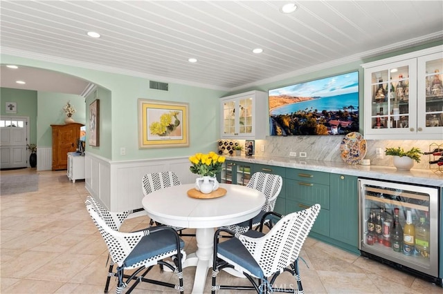 2172 N Pami Cir, Orange, CA 92867 - dining room with beverage cooler, crown molding, a dry bar, recessed lighting, and a wainscoted wall