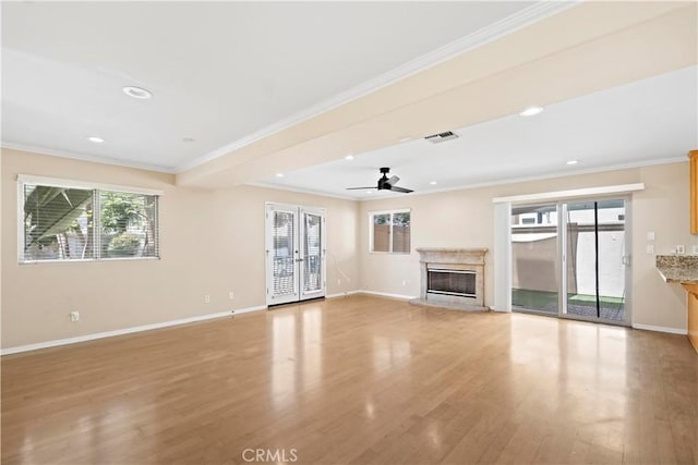3919 W 242nd St Unit A, Torrance, CA 90505 - unfurnished living room featuring light wood finished floors, a high end fireplace, crown molding, recessed lighting, and a ceiling fan