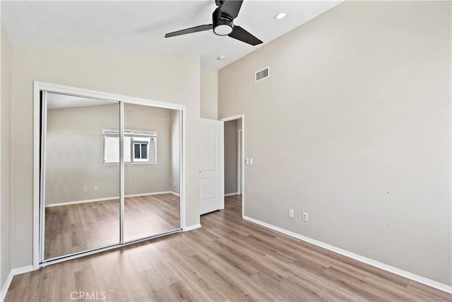 3919 W 242nd St Unit A, Torrance, CA 90505 - unfurnished bedroom with wood finished floors, a closet, a high ceiling, a ceiling fan, and recessed lighting