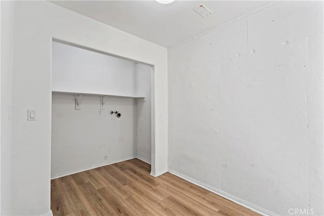 3919 W 242nd St Unit A, Torrance, CA 90505 - laundry room featuring wood finished floors and baseboards