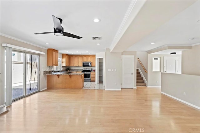 3919 W 242nd St Unit A, Torrance, CA 90505 - kitchen featuring stainless steel appliances, crown molding, ceiling fan, a peninsula, and light wood-type flooring