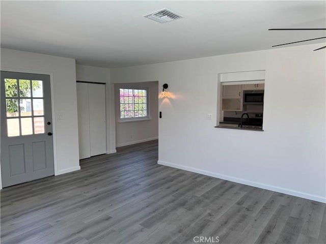 5781 Lime Ave, Cypress, CA 90630 - unfurnished living room with wood finished floors