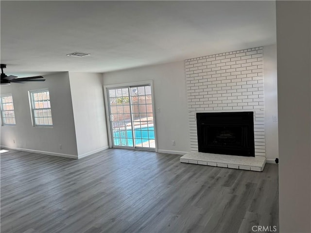 5781 Lime Ave, Cypress, CA 90630 - unfurnished living room featuring wood finished floors, a ceiling fan, plenty of natural light, and a fireplace