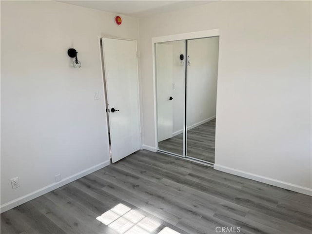 5781 Lime Ave, Cypress, CA 90630 - unfurnished bedroom featuring a closet and wood finished floors