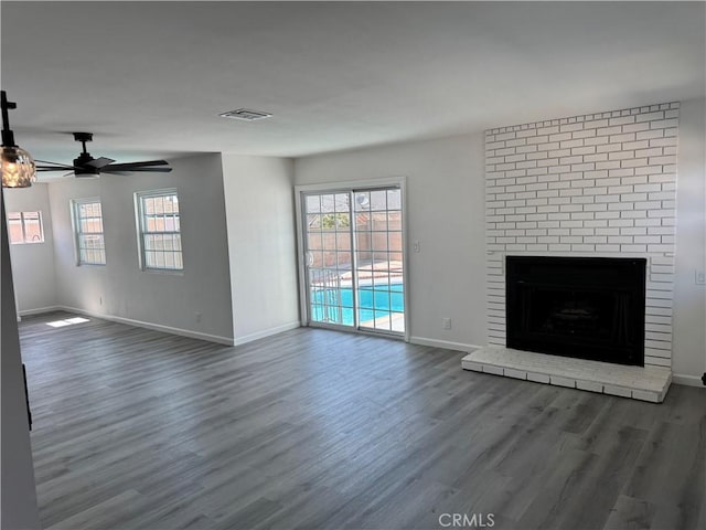5781 Lime Ave, Cypress, CA 90630 - unfurnished living room featuring wood finished floors, a ceiling fan, and a brick fireplace