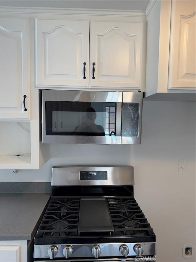 5781 Lime Ave, Cypress, CA 90630 - kitchen view of appliances with stainless steel finishes, white cabinets, and dark countertops
