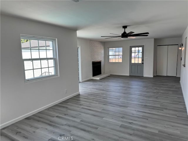 5781 Lime Ave, Cypress, CA 90630 - unfurnished living room featuring ceiling fan, wood finished floors, and a fireplace
