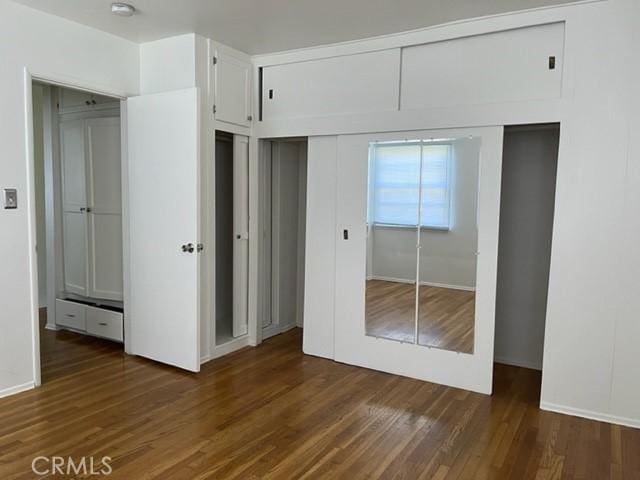 10856 Camarillo St, Toluca Lake, CA 91602 - unfurnished bedroom with wood finished floors and a closet