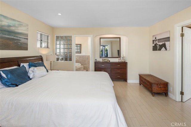 259 62nd, Newport Beach, CA 92663 - bedroom featuring light wood finished floors, recessed lighting, arched walkways, and ensuite bathroom