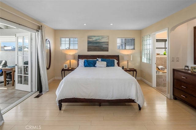 259 62nd, Newport Beach, CA 92663 - bedroom with arched walkways, recessed lighting, multiple windows, and light wood-style flooring
