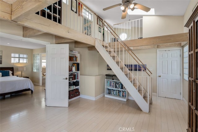 259 62nd, Newport Beach, CA 92663 - staircase with ceiling fan, wood finished floors, and a high ceiling