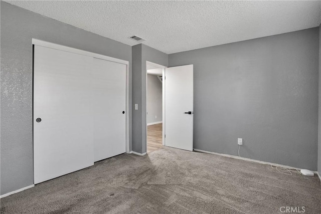 12178 Galaxy St, Victorville, CA 92392 - unfurnished bedroom with carpet floors, a closet, and a textured ceiling