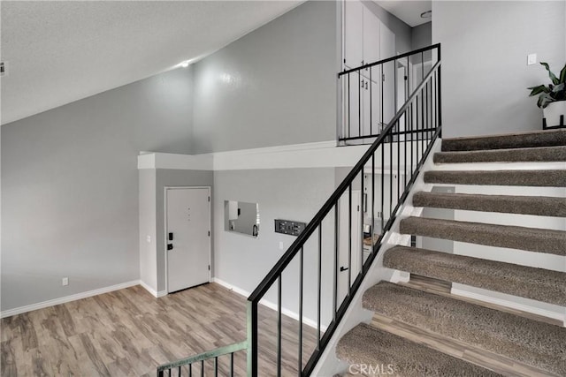12178 Galaxy St, Victorville, CA 92392 - stairs featuring high vaulted ceiling and wood finished floors