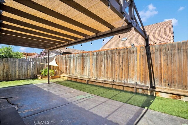 12178 Galaxy St, Victorville, CA 92392 - fenced backyard featuring a patio area