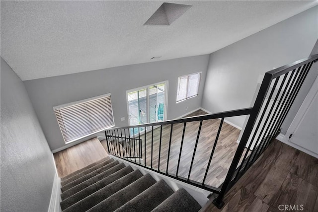 12178 Galaxy St, Victorville, CA 92392 - stairs with wood finished floors and a textured ceiling