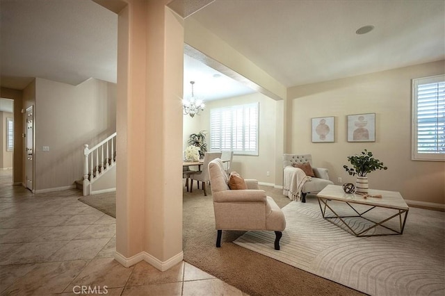 25217 Pacific Crest St, Corona, CA 92883 - sitting room featuring a chandelier, carpet, stairs, and tile patterned flooring