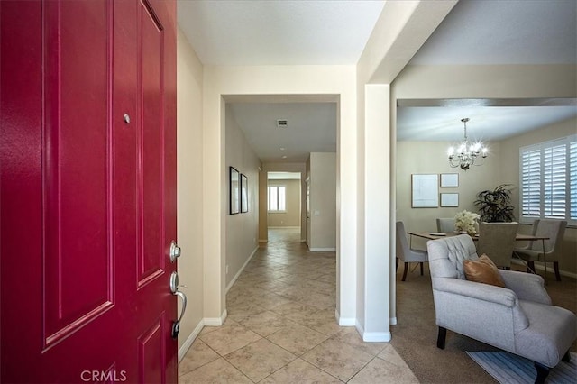 25217 Pacific Crest St, Corona, CA 92883 - foyer entrance with a chandelier, healthy amount of natural light, and light tile patterned floors