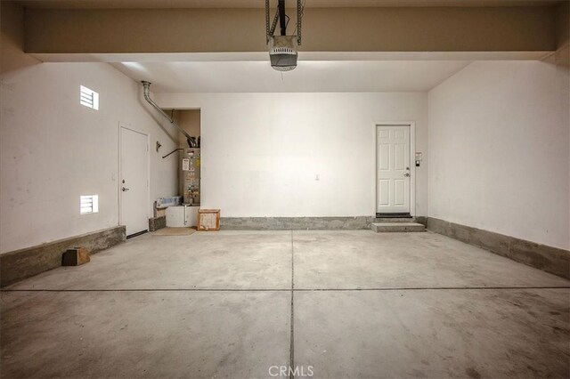 25217 Pacific Crest St, Corona, CA 92883 - garage featuring water heater and a garage door opener