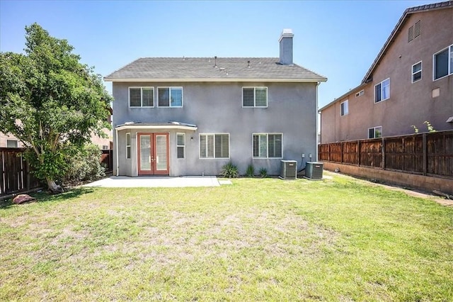 25217 Pacific Crest St, Corona, CA 92883 - back of property featuring french doors, a chimney, a patio, and a fenced backyard