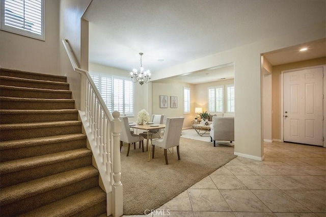 25217 Pacific Crest St, Corona, CA 92883 - dining area with stairs, light colored carpet, a chandelier, light tile patterned flooring, and recessed lighting
