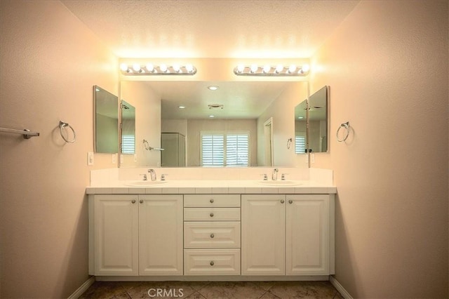 25217 Pacific Crest St, Corona, CA 92883 - full bathroom featuring double vanity, tile patterned floors, and a shower