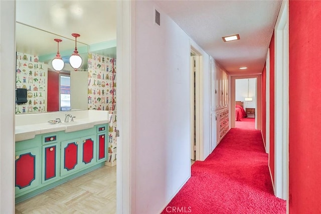 17313 Citronia St, Northridge, CA 91325 - corridor with a sink and light carpet