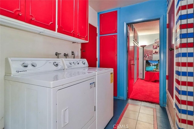 17313 Citronia St, Northridge, CA 91325 - laundry area featuring washing machine and dryer, cabinet space, light tile patterned flooring, and light carpet