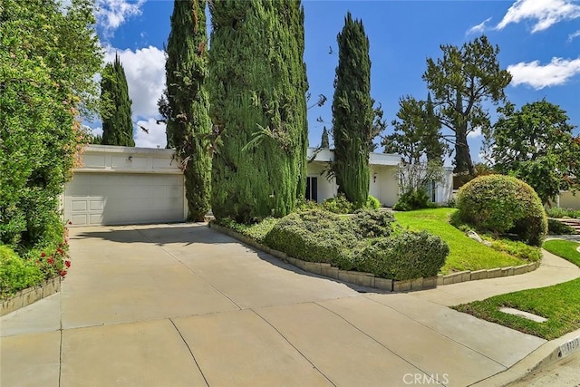17313 Citronia St, Northridge, CA 91325 - obstructed view of property featuring concrete driveway and an attached garage