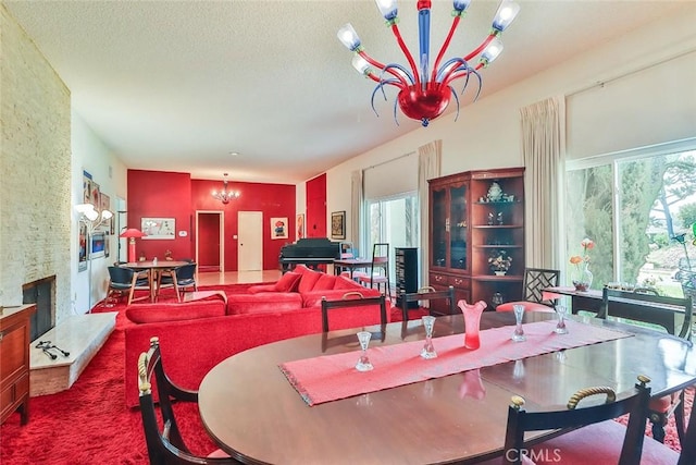 17313 Citronia St, Northridge, CA 91325 - carpeted dining space featuring a chandelier and a stone fireplace